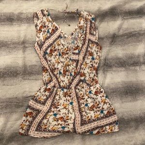 White and floral romper from high end boutique. Size S
